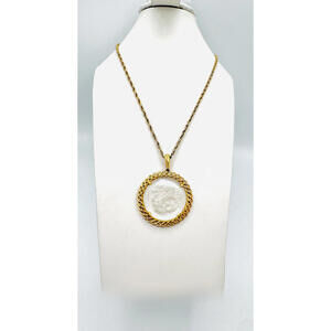 Crown Trifari gold tone chain w/ reversed carved zodiac sign "Leo" round pendant